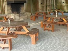 Undercover seating and open fire. so if it rains you can still have shelter and a fire.