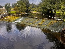 Walk along the river to the town