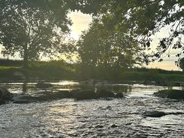 Rivier voor de plek