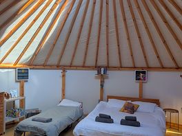 Inside yurt, comfy bed