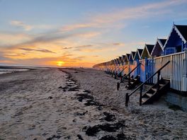 Sunset near beach huts