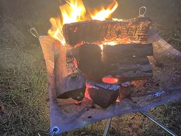 Keeping warm by fire