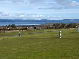 Grass pitches overlooking the Moray Firth