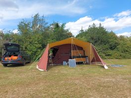 Our trailer tent and solar panels. no electric hookup needed.