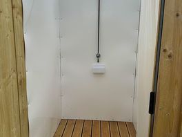 Unisex spacious hot showers.