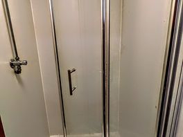 Shower doors broke in 2 toilets mens & womens