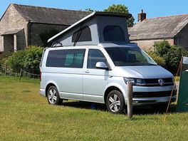 Hardstanding grass pitch for a campervan with electric.