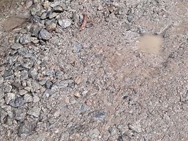 Puddles in our pitch despite no rain for over a month.