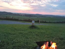 A camp fire and beautiful sunset
