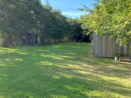The communal field with a little reading/games covered area
