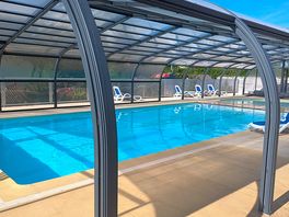 A well kept super clean swimming pool.