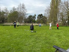 Playing badminton outside the caravan
