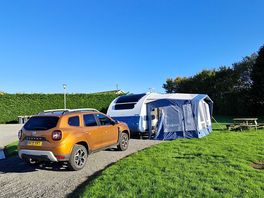The hard standing with grass pitch