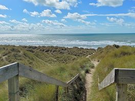 Stunning ynyslas a beach through the dunes.