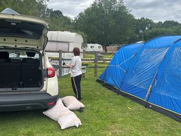 Setting up tent with the help of the kids