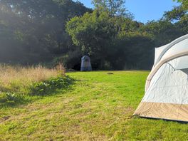 Both pitches have a toilet, wash stand and a picnic table. there's also a kitchen tent.