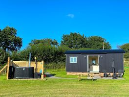 Exterior of hut and hot tub