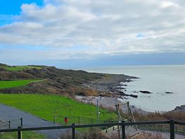 On the small beach down from the clubhouse