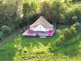 Red bell tent on decking