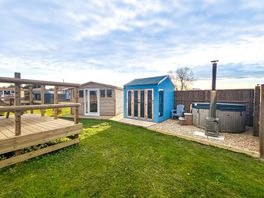 Poppy with her separate kitchen and private raised deck with hot tub