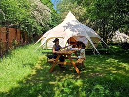 Our tent with dinning area outside with fire pit and bbq