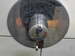 Dirty soap scum embedded into chrome