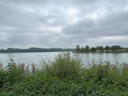 Easy access to swimming lake on site .