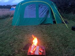 The fire in front of the tent.