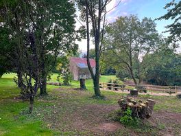 View of pond and barn