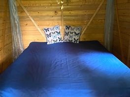 A very comfortable bed, lights & charging points.