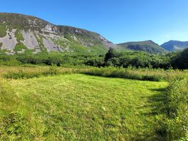 Grass pitch and Gyrn Ddu mountain
