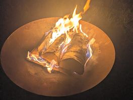 Fire pit with logs burning