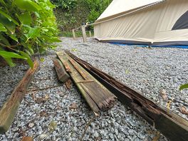 Scrap wood and nails left next to our tent