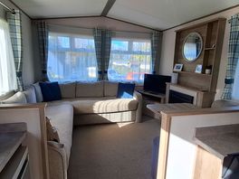 Inside: kitchen, lounge and dining area