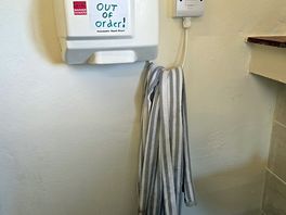 Out of order hand dryer and dirty towel that had been there all of our stay.