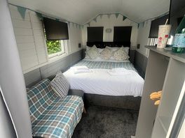 Small but warm. 2 windows for air and a very comfy bed!