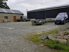 Cluttered with vehicles around the toilet blocks