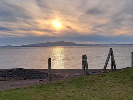 Beautiful sunset over the water and mountains