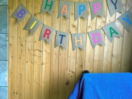 Claire set up a bday banner on arrival