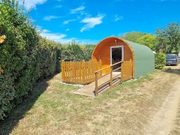 Camping pod with a fence