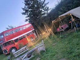 Kitchen area next to a retro bus