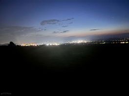 Lights over the hill at midnight