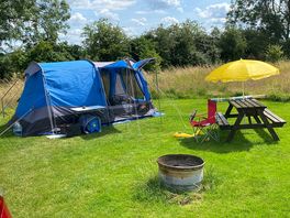 My pitch with picnic table and fire pit.