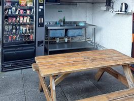 Kichen area with charging station.