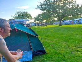 By the tent