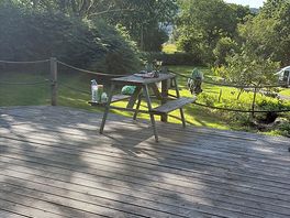 Picnic tables located near pitch.