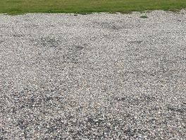 Lovely view of the gravel ‘pitches’, an old ambulance and a rusty caravan!