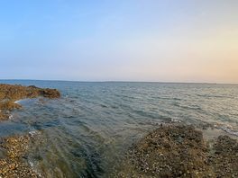 Panoramic view of la baie beach at sunset