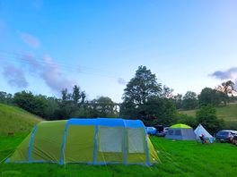 Set up at the far end, close to river.