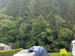 Our pitch next to the river and trees